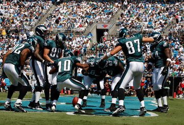 CHARLOTTE, NC - SEPTEMBER 13:  Members of the Philadelphia Eagles celebrate in the endzone after a touchdown by tight end Brent Celek #87, in the first half of the NFL season opener against the Carolina Panthers at Bank of America Stadium on September 13, 2009 in Charlotte, North Carolina.  (Photo by Streeter Lecka/Getty Images)