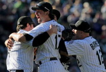 DENVER - OCTOBER 01:  Ian Stewart #9, Todd Helton #17, Troy Tulowitzki #2 and Clint Barmes #12 of the Colorado Rockies celebrate after the final out as they defeated the Milwaukee Brewers 9-2 and clinched a National League playoff berth at Coors Field on October 1, 2009 in Denver, Colorado.  (Photo by Doug Pensinger/Getty Images)
