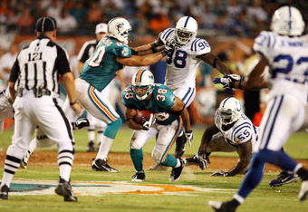 MIAMI - SEPTEMBER 21:  Running back Patrick Cobbs #38 of the Miami Dolphins looks for room to run against the Indianapolis Colts at Land Shark Stadium on September 21, 2009 in Miami, Florida. The Colts defeated the Dolphins 27-23.  (Photo by Doug Benc/Getty Images)