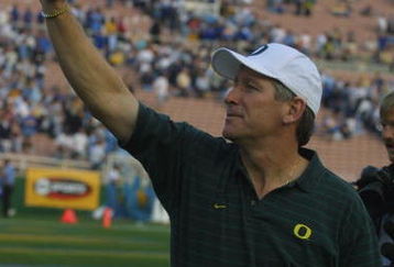 PASADENA, CA - NOVEMBER 10:  Head coach Mike Belotti of the Oregon Ducks waves to the stands after winning the Pac-10 Conference football game on Novemver 10, 2001 against the UCLA Bruins at the Rose Bowl in Pasadena, California. The Ducks defeated the Bruins 21-20. (Photo by Jeff Gross/Getty Images)   