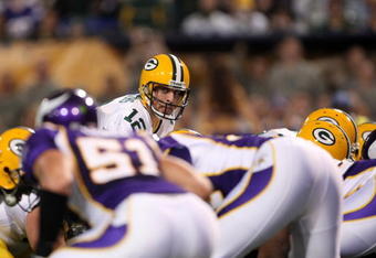MINNEAPOLIS - NOVEMBER 09:  Quarterback Aaron Rodgers #12 of the Green Bay Packers calls signals against the Minnesota Vikings on November 9, 2008 at the Metrodome in Mineapolis, Minnesota.  The Vikings won 28-27.  (Photo by Stephen Dunn/Getty Images)