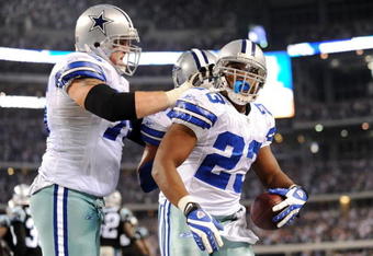 ARLINGTON, TX - SEPTEMBER 28: Tashard Choice #23 of the Dallas Cowboys celebrates with teammate Marc Colombo #75 after rushing for a touchdown in the third quarter against the Carolina Panthers at Cowboys Stadium on September 28, 2009 in Arlington, Texas. (Photo by Ronald Martinez/Getty Images)