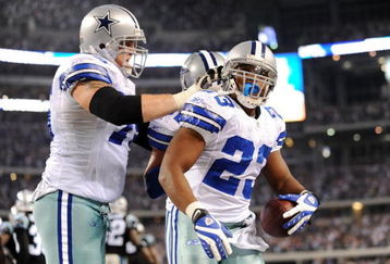 ARLINGTON, TX - SEPTEMBER 28: Tashard Choice #23 of the Dallas Cowboys celebrates with teammate Marc Colombo #75 after rushing for a touchdown in the third quarter against the Carolina Panthers at Cowboys Stadium on September 28, 2009 in Arlington, Texas. (Photo by Ronald Martinez/Getty Images)