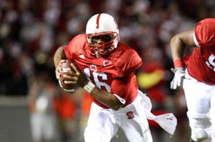 RALEIGH, NC - SEPTEMBER 3:  Quarterback Russell Wilson #16 of the North Carolina State Wolfpack scrambles for yards after avoiding the tackle by Nathan Pepper #95 of the South Carolina Gamecocks during the game at Carter-Finley Stadium on September 3, 2009 in Raleigh, North Carolina. (Photo by Streeter Lecka/Getty Images)