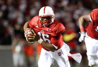 RALEIGH, NC - SEPTEMBER 3:  Quarterback Russell Wilson #16 of the North Carolina State Wolfpack scrambles for yards after avoiding the tackle by Nathan Pepper #95 of the South Carolina Gamecocks during the game at Carter-Finley Stadium on September 3, 2009 in Raleigh, North Carolina. (Photo by Streeter Lecka/Getty Images)