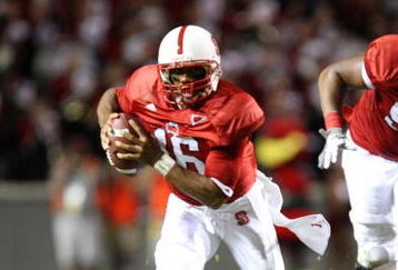 RALEIGH, NC - SEPTEMBER 3:  Quarterback Russell Wilson #16 of the North Carolina State Wolfpack scrambles for yards after avoiding the tackle by Nathan Pepper #95 of the South Carolina Gamecocks during the game at Carter-Finley Stadium on September 3, 2009 in Raleigh, North Carolina. (Photo by Streeter Lecka/Getty Images)