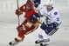 CALGARY, AB - OCTOBER 1:  Craig Conroy #24 of the Calgary Flames tries to get around Henrik Sedin #33 of the Vancouver Canucks in the second period of NHL action during the season opener on October 1, 2009 at the Pengrowth Saddledome in Calgary, Alberta, Canada. (Photo by Mike Ridewood/Getty Images)