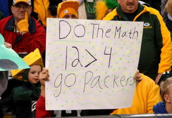 GREEN BAY, WI - OCTOBER 19:  A Packer fan holds a sign supporting Aaron Rodgers over Brett Favre during the game between the Green Bay Packers and the Indianapolis Colts on October 19, 2008 at Lambeau Field in Green Bay Wisconsin. The Packers won 34-14.   (Photo by Stephen Dunn/Getty Images)