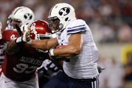 ARLINGTON, TX - SEPTEMBER 05: Running back Manase Tonga #11 of the Brigham Young Cougars at Cowboys Stadium on September 5, 2009 in Arlington, Texas.  (Photo by Ronald Martinez/Getty Images)