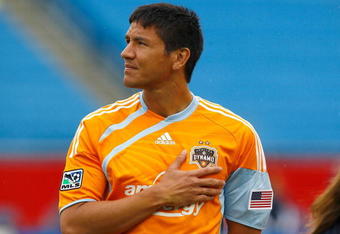 FOXBOROUGH, MA - MAY 3: Brian Ching #25 of the Houston Dynamo stands for the National Anthem before the game against the New England Revolution at Gillette Stadium on May 3, 2009 in Foxborough, Massachusetts.  (Photo by Jim Rogash/Getty Images)