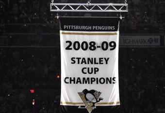 PITTSBURGH - OCTOBER 2:  The Pittsburgh Penguins raise their Stanley Cup Champions banner before their game against the New York Rangers on October 2, 2009 at Mellon Arena in Pittsburgh, Pennsylvania.  (Photo by Jamie Sabau/Getty Images)