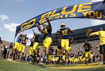 ANN ARBOR, MI - SEPTEMBER 5:  Michigan Wolverines players enter the stadium before the game against the Western Michigan Broncos on September 5, 2009 at Michigan Stadium in Ann Arbor, Michigan. (Photo by Gregory Shamus/Getty Images)