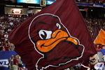 ATLANTA - SEPTEMBER 05:   A cheerleader runs a flag for the Virginia Tech Hokies across the field against the Alabama Crimson Tide during the Chick-fil-A Kickoff Game at Georgia Dome on September 5, 2009 in Atlanta, Georgia.  (Photo by Kevin C. Cox/Getty Images)