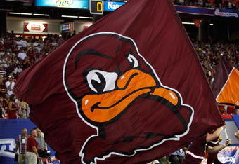 ATLANTA - SEPTEMBER 05:   A cheerleader runs a flag for the Virginia Tech Hokies across the field against the Alabama Crimson Tide during the Chick-fil-A Kickoff Game at Georgia Dome on September 5, 2009 in Atlanta, Georgia.  (Photo by Kevin C. Cox/Getty Images)