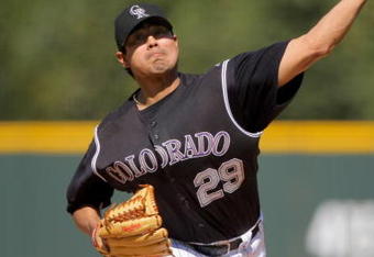 DENVER - SEPTEMBER 27:  Starting pitcher Jorge De La Rosa #29 of the Colorado Rockies delivers against the St. Louis Cardinals at Coors Field on September 27, 2009 in Denver, Colorado. De La Rosa earned the win as the Rockies defeated the Cardinals 4-3.  (Photo by Doug Pensinger/Getty Images)