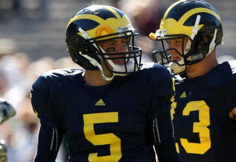 ANN ARBOR, MI - SEPTEMBER 19:  Quarterback Tate Forcier #5 of the Michigan Wolverines warms up for the game against the Eastern Michigan Eagles at Michigan Stadium on September 19, 2009 in Ann Arbor, Michigan.  Michigan won 45-17.  (Photo by Stephen Dunn/Getty Images)