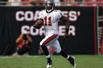 TAMPA, FL - SEPTEMBER 27:  Quarterback Josh Johnson #11 of the Tampa Bay Buccaneers runs the ball against the New York Giants during the game at Raymond James Stadium on September 27, 2009 in Tampa, Florida.  (Photo by J. Meric/Getty Images)