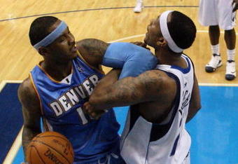 DALLAS - MAY 11:  Forward Carmelo Anthony #15 of the Denver Nuggets gets his elbow locked with Antoine Wright #21 of the Dallas Mavericks in Game Four of the Western Conference Semifinals during the 2009 NBA Playoffs at American Airlines Center on May 11, 2009 in Dallas, Texas. NOTE TO USER: User expressly acknowledges and agrees that, by downloading and or using this photograph, User is consenting to the terms and conditions of the Getty Images License Agreement.  (Photo by Ronald Martinez/Getty Images)