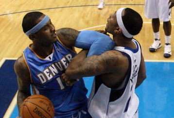 DALLAS - MAY 11:  Forward Carmelo Anthony #15 of the Denver Nuggets gets his elbow locked with Antoine Wright #21 of the Dallas Mavericks in Game Four of the Western Conference Semifinals during the 2009 NBA Playoffs at American Airlines Center on May 11, 2009 in Dallas, Texas. NOTE TO USER: User expressly acknowledges and agrees that, by downloading and or using this photograph, User is consenting to the terms and conditions of the Getty Images License Agreement.  (Photo by Ronald Martinez/Getty Images)