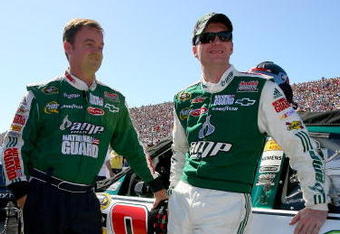 LOUDON, NH - SEPTEMBER 20:  Dale Earnhardt Jr. (R) and crew chief Lance McGrew (L) stand beside the #88 AMP Energy/National Guard Chevrolet prior to the NASCAR Sprint Cup Series Sylvania 300 at the New Hampshire Motor Speedway on September 20, 2009 in Loudon, New Hampshire.  (Photo by Jason Smith/Getty Images for NASCAR)