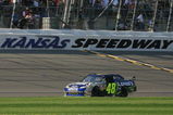 KANSAS CITY, KS - SEPTEMBER 28:  Jimmie Johnson, driver of the #48 Lowe's Chevrolet, crosses the finish line to win the NASCAR Sprint Cup Series Camping World RV 400 at Kansas Speedway on September 28, 2008 in Kansas City, Kansas.  (Photo by Jerry Markland/Getty Images for NASCAR)