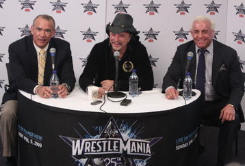 HOUSTON, TX - APRIL 5:  Former professional wrestler Ricky 'The Dragon' Steamboat and 'Nature Boy' Ric Flair looks on as actor Mickey Rourke discusses his wishes to not get involved in a match with WWE Superstar Chris Jericho during a press conference before WrestleMania 25 at Reliant Stadium on April 5, 2009 in Houston, Texas.  (Photo by Bill Olive/Getty Images)