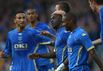 PORTSMOUTH, UNITED KINGDOM - SEPTEMBER 18:  Lassana Diarra of Portsmouth celebrates with his team-mates after scoring the first goal for Portsmouth during the UEFA Cup round one first leg match between Portsmouth and Guimaraes at Fratton Park on September 18, 2008 in Portsmouth, England.  (Photo by Paul Gilham/Getty Images)