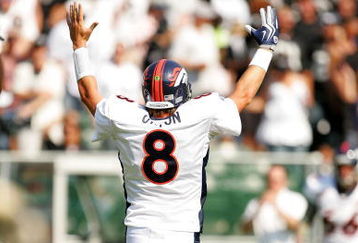 OAKLAND, CA - SEPTEMBER 27:  Kyle Orton #8 of the Denver Broncos celebrates a touchdown during their game against the Oakland Raiders at the Oakland-Alameda County Coliseum on September 27, 2009 in Oakland, California.  (Photo by Ezra Shaw/Getty Images)