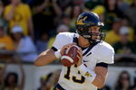 EUGENE, OR - SEPTEMBER 26: Quarterback Kevin Riley #13 of the California Bears looks for a receiver as he rolls out in the third quarter of the game against the Oregon Ducks at Autzen Stadium on September 26, 2009 in Eugene, Oregon. Oregon won the game 42-3. (Photo by Steve Dykes/Getty Images)