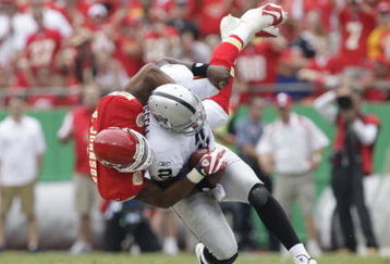 KANSAS CITY, MO - SEPTEMBER 20:  Derrick Johnson #56 of the Kansas City Chiefs sacks JaMarcus Russell #2 of the Oakland Raiders during the game at Arrowhead Stadium on September 20, 2009 in Kansas City, Missouri. (Photo by Jamie Squire/Getty Images)
