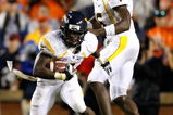 AUBURN, AL - SEPTEMBER 19:  Quarterback Jarrett Brown #16 and Noel Devine #7 of the West Virginia Mountaineers against the Auburn Tigers at Jordan-Hare Stadium on September 19, 2009 in Auburn, Alabama.  (Photo by Kevin C. Cox/Getty Images)