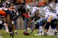DENVER - AUGUST 16:  Center Andre Gurode #65 of the Dallas Cowboy prepares to snap the ball against the Denver Broncos during preseason NFL action at Invesco Field at Mile High on August 16, 2008 in Denver, Colorado. The Broncos defeated the Cowboys 23-13.  (Photo by Doug Pensinger/Getty Images)