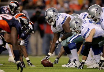 DENVER - AUGUST 16:  Center Andre Gurode #65 of the Dallas Cowboy prepares to snap the ball against the Denver Broncos during preseason NFL action at Invesco Field at Mile High on August 16, 2008 in Denver, Colorado. The Broncos defeated the Cowboys 23-13.  (Photo by Doug Pensinger/Getty Images)