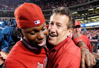 ANAHEIM, CA - SEPTEMBER 28:  Arte Moreno (R) owner of the Los Angeles Angels of Anaheim celebrates with center fielder Torii Hunter after winning the American League West title in the baseball agme against Texas Rangers at Angel Stadium on September 28, 2009 in Anaheim, California.  (Photo by Kevork Djansezian/Getty Images)