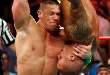LAS VEGAS - AUGUST 24:  Wrestler John Cena picks up wrestler Randy Orton during the WWE Monday Night Raw show at the Thomas & Mack Center August 24, 2009 in Las Vegas, Nevada.  (Photo by Ethan Miller/Getty Images)