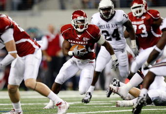 ARLINGTON, TX - OCTOBER 03:  Running back Michael Smith #21 of the Arkansas Razorbacks runs against the Texas A&M Aggies at Cowboys Stadium on October 3, 2009 in Arlington, Texas.  (Photo by Ronald Martinez/Getty Images)