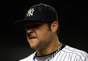 NEW YORK - SEPTEMBER 30:  Joba Chamberlain #62 of the New York Yankees walks off the field after being relieved in the 4th inning during the game on September 30, 2009 at Yankee Stadium in the Bronx borough of New York City.  (Photo by Jared Wickerham/Getty Images)