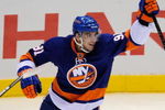 UNIONDALE, NY - OCTOBER 03: John Tavares #91 of the New York Islanders celebrates his first NHL assist on a goal scored by teammate Mark Streit in the first period against the Pittsburgh Penguins on October 3, 2009 in Uniondale, New York.  (Photo by Paul Bereswill/Getty Images)