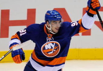 UNIONDALE, NY - OCTOBER 03: John Tavares #91 of the New York Islanders celebrates his first NHL assist on a goal scored by teammate Mark Streit in the first period against the Pittsburgh Penguins on October 3, 2009 in Uniondale, New York.  (Photo by Paul Bereswill/Getty Images)