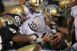 SOUTH BEND, IN - OCTOBER 03: Members of the Notre Dame Fighting Irish defense stop Jake Locker #10 of the Washington Huskies on third down at the goal line in the 4th quarter on October 3, 2009 at Notre Dame Stadium in South Bend, Indiana. Notre Dame defeated Washington 37-30 in overtime. (Photo by Jonathan Daniel/Getty Images)