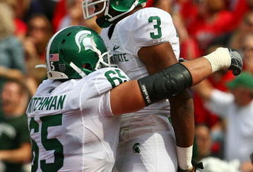 MADISON, WI - SEPTEMBER 26: B.J. Cunningham #3 of the Michigan State Spartans celebrates a touchdown catch with teammate Joel Nitchman #65 against the Wisconsin Badgers on September 26, 2009 at Camp Randall Stadium in Madison, Wisconsin. Wisconsin defeated Michigan State 38-30. (Photo by Jonathan Daniel/Getty Images)