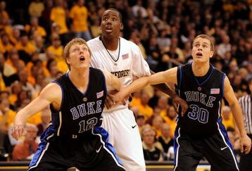 WINSTON-SALEM, NC - JANUARY 28: James Johnson #23 of the Wake Forest Demon Deacons positions for a rebound against Kyle Singler #12 and Jon Scheyer #30 of the Duke Blue Devils at Lawrence Joel Coliseum on January 28, 2009 in Winston-Salem, North Carolina. Wake Forest won the game 70-68. (Photo by Steve Dykes/Getty Images)