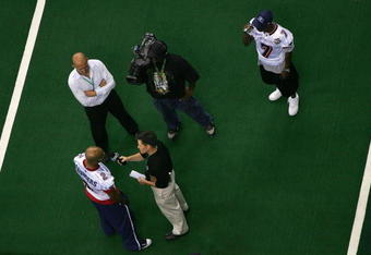 NEW ORLEANS - JULY 27:  David Saunders #2 of the Columbus Destroyers speaks with the media as teammates Josh Bush records video of the interview during ArenaBowl XXI Media Day at the New Orleans Arena on July 27, 2007 in New Orleans, Louisiana. The Destroyers will play the San Jose SaberCats in ArenaBowl XXI on Sunday July 29.  (Photo by Doug Pensinger/Getty Images for AFL)