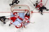 STOCKHOLM, SWEDEN - OCTOBER 03:  #7 Keith Tkachuk of St. Louis Blues (Top Right) scores a goal during the 2009 Compuware NHL Premiere Stockholm match between St. Louis Blues and Detroit Red Wings at the Ericsson Globe on October 3, 2009 in Stockholm, Sweden.  (Photo by Paul Gilham/Getty Images)