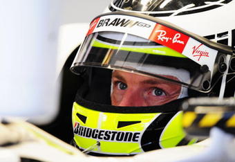 SUZUKA, JAPAN - OCTOBER 02:  Jenson Button of Great Britain and Brawn GP prepares to drive during practice for the Japanese Formula One Grand Prix at Suzuka Circuit on October 2, 2009 in Suzuka, Japan.  (Photo by Clive Mason/Getty Images)