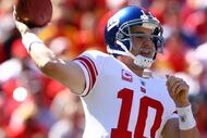 KANSAS CITY, MO - OCTOBER 04:  Quarterback Eli Manning #10 of the New York Giants passes during the game against the Kansas City Chiefs on October 4, 2009 at Arrowhead Stadium in Kansas City, Missouri.  (Photo by Jamie Squire/Getty Images)