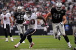 HOUSTON - OCTOBER 04:  Running back Steve Slaton #20 of the Houston Texans runs for a touchdown past Trevor Scott #91 of the Oakland Raiders at Reliant Stadium on October 4, 2009 in Houston, Texas.  (Photo by Ronald Martinez/Getty Images)