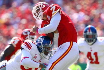 KANSAS CITY, MO - OCTOBER 04:  Quarterback Matt Cassel #7 of the Kansas City Chiefs is hit by Antonio Pierce #58 of the New York Giants during the game on October 4, 2009 at Arrowhead Stadium in Kansas City, Missouri.  (Photo by Jamie Squire/Getty Images)