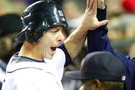 DETROIT - SEPTEMBER 30:  Brandon Inge #15 of the Detroit Tigers is greeted at the dugout after scoring a run in the second inning off a Ramon Santiago #39 single against the Minnesota Twins during the game on September 30, 2009 at Comerica Park in Detroit, Michigan. (Photo by Gregory Shamus/Getty Images)