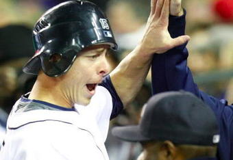 DETROIT - SEPTEMBER 30:  Brandon Inge #15 of the Detroit Tigers is greeted at the dugout after scoring a run in the second inning off a Ramon Santiago #39 single against the Minnesota Twins during the game on September 30, 2009 at Comerica Park in Detroit, Michigan. (Photo by Gregory Shamus/Getty Images)